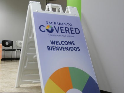 FILE - In this Feb. 12, 2015 file photo Laura San Nicolas, right, and her daughter Geena, wait to meet with an enrollment counselor to sign up for health insurance at Sacramento Covered in Sacramento, Calif. California's Democratically controlled government is looking at a defensive future under President-elect Donald Trump …