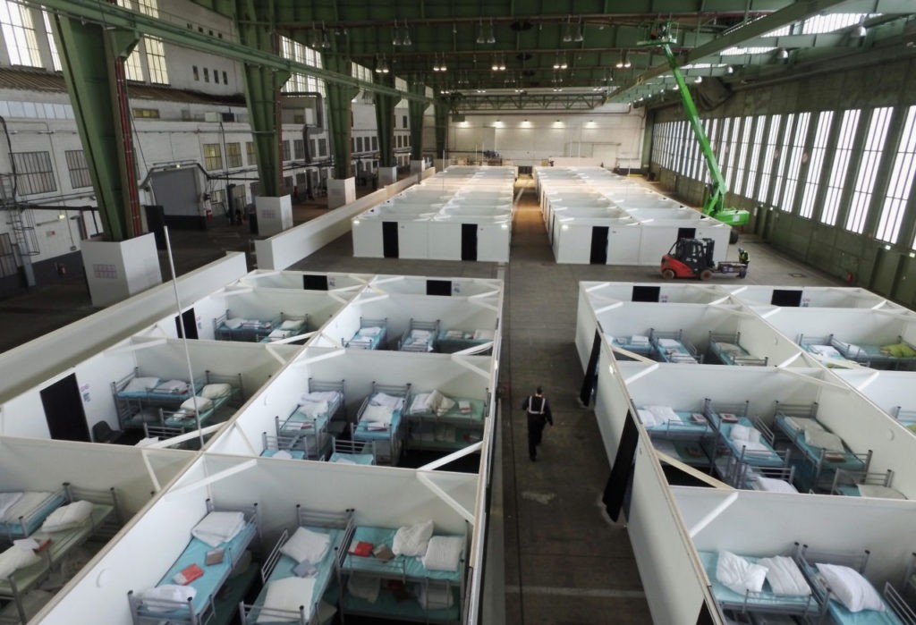 BERLIN, GERMANY - FEBRUARY 11: In this aerial view cubicles furnished with bunk beds stand ready to accommodate refugees and asylum applicants in Hangar 6 of former Tempelhof Airport on February 11, 2016 in Berlin, Germany. Tempelhof, once an airport in the city center and first built in the 1930s, now houses approximately 2,600 refugees in three former hangars. Berlin city authorities recently approved plans to expand its capacity to house the newcomers with an additional 90 shelters with space for 30,000 people. An estimated 50,000-80,000 migrants and refugees already live in Berlin. Germany received 1.1 million refugees and migrants in 2015 and is expecting to continue to receive large numbers in 2016. (Photo by Sean Gallup/Getty Images)