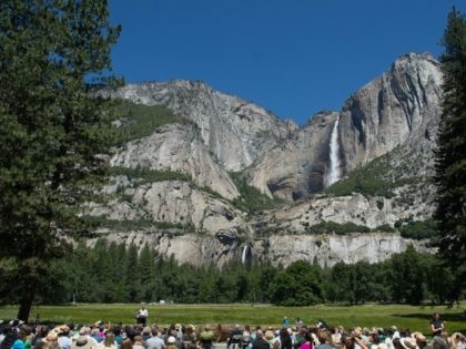 President Barack Obama speaks in front of Cook's Meadow and Yosemite Falls on June 18, 2016 in Yosemite National Park, California. Obama is marking the centennial of the National Park Service which began on August 25, 1916. (Photo by)