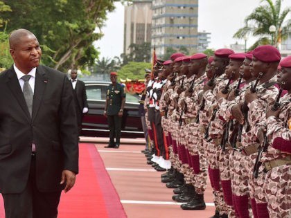 Central African Republic's President Faustin-Archange Touadera reviews the troops upo