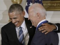 U.S. President Barack Obama (R) presents the Medal of Freedom to Vice-President Joe Biden during an event in the State Dinning room of the White House, January 12, 2017 in Washington, DC. (Photo by