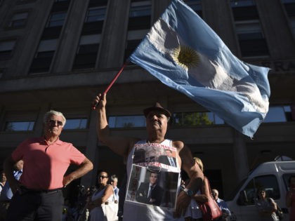 Activists take part in a ceremony marking the second anniversary of the controversial death of Argentinian prosecutor Alberto Nisman on January 18, 2017 in Buenos Aires. Nisman died in mysterious circumstances in January 18, 2015, after accusing Argentina's then president, Cristina Fernandez de Kirchner, of obstructing his investigation of a …