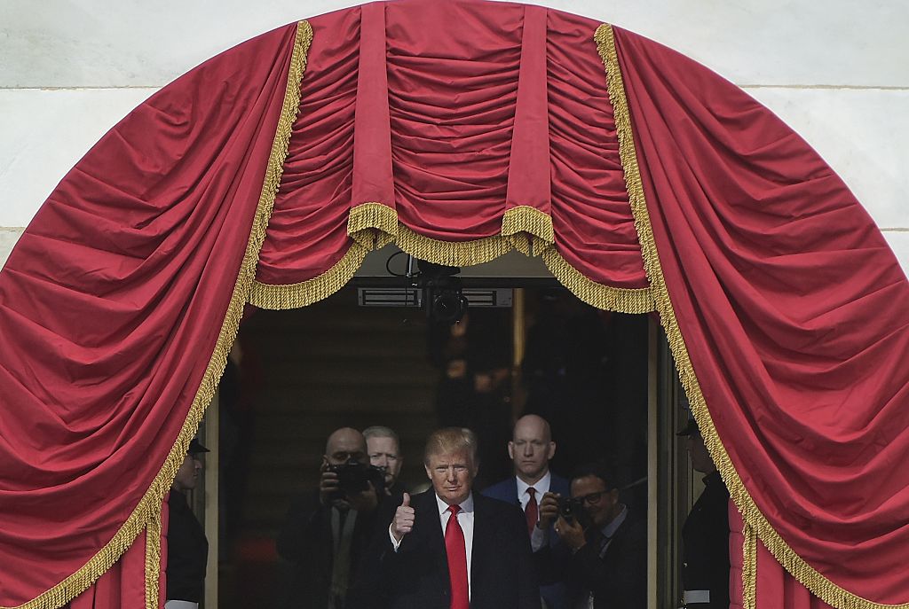 US President-elect Donald Trump flashes the thumbs-up as he steps out of the US Capitol his inauguration on January 20, 2017 in Washington, DC. / AFP / MANDEL NGAN (Photo credit should read MANDEL NGAN/AFP/Getty Images)