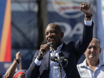 South Africa main opposition party Democratic Alliance leader Mmusi Maimane gestures as he addresses the crowd of supporters during a campaign rally on April 23, 2016 at the Rand Stadium in Johannesburg, ahead of August municipal elections. South Africa's main opposition party launched its campaign by targeting black voters disillusioned …