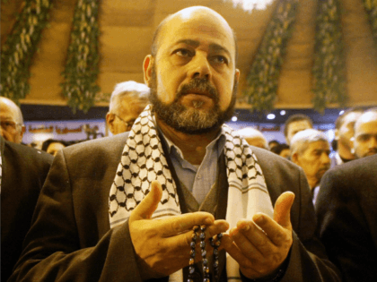 Hamas deputy leader Mousa abu Marzouk reads verses of the Quran for the spirits of Palestinian martyrs during the opening of the National Palestinian Meeting on January 23, 2008 in Damascus, Syria. Oposition Palestinian factions gathered with representatives of Hizbullah and Iran, in a summit aiming to reform the Palestinian …
