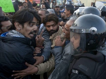 An civil society activist argues with police officers during a rally demanding recovery of the missing persons in Karachi, Pakistan, Thursday, Jan. 19, 2017. Pakistani police say a clash has been averted between the supporters of missing human rights activists and clerics in southern port city of Karachi. (AP Photo/Shakil …