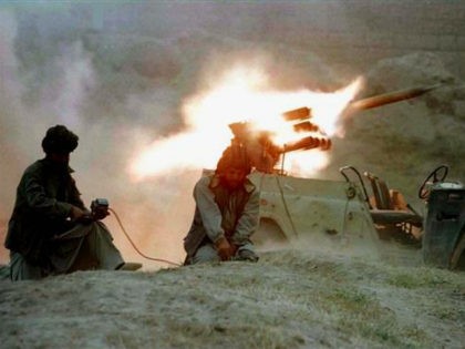 Taliban fighters fire a jeep-mounted BM-12 rocket towards a village north of Kabul, October 11, 1996. REUTERS/File