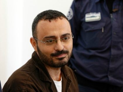 Palestinian Waheed Borsh, a UN Development Programme employee in Gaza who is accused of aiding the Islamist movement Hamas, looks on during his indictment at a district court in the southern Israeli city of Beersheva on August 28, 2016. / AFP / AHMAD GHARABLI (Photo credit should read AHMAD GHARABLI/AFP/Getty …
