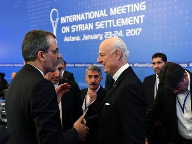 UN envoy for Syria Staffan de Mistura (C) meets with an Iranian delegation prior to the fi