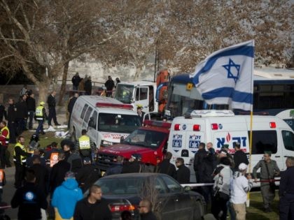 JERUSALEM, ISRAEL - JANUARY 08: (ISRAEL OUT) Israeli security forces and emergency personnel gather at the site of a vehicle-ramming attack on January 8, 2017 in Jerusalem, Israel. Four israeli soldiers were killed and 13 wounded after an industrial truck driven by a Palestinian man, rammed into a group of …