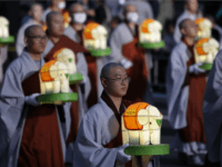 Buddhist monk carry colorful lanterns as they celebrate the forthcoming birthday of Buddha at Jogye temple on May 7, 2016 in Seoul, South Korea. Buddha was born approximately 2,560 years ago, and although the exact date is unknown, Buddha's official birthday is celebrated on the full moon in May in …