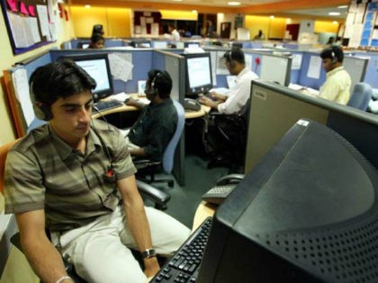 Employees at a call centre provide service support to international customers in Bangalore