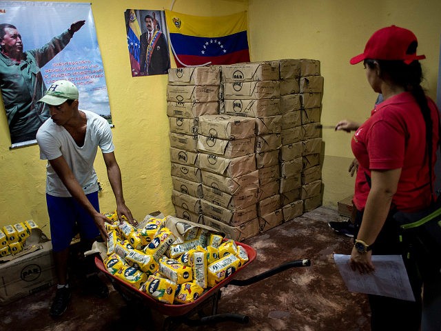 CLAPs members sort groceries for delivery in the Catia neighborhood on the outskirts of Ca
