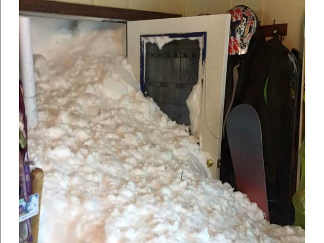 Controlled Avalanche Causes Snow to Block Entrance to House