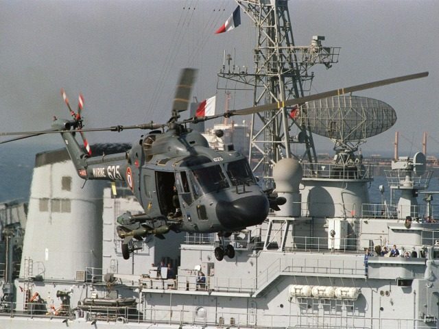 An armed French Navy helicopter aboard the French warship Dupleix takes off as the warship escorts 3 French flagged tankers out of the Gulf December 26, 1987, off the coast of Dubaï. On December 24, 1987, a U.S. Navy helicopter was shot at by Iranian speed-boats