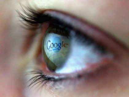 In this photo illustration the Google logo is reflected in the eye of a girl on February 3