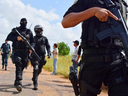 BRAZIL OUT - Heavily armed police officers walk outside the Agricultural Penitentiary of M