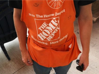 An employee wears his apron at The Home Depot store on May 17, 2016 in Miami, Florida. Home Depot raised its yearly outlook after first quarter sales figures showed the home improvement retailer had a net profit of $1.8 billion, or $1.44 share, compared with $1.58 billion, or $1.21 a …