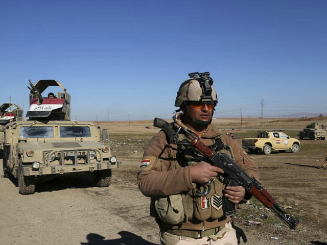 Iraqi Army soldiers deploy after defeating Islamic State militants in the eastern side of