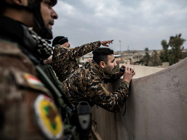 Iraqi members of the Special Forces scan the area held by Islamic state militants from a roof in Mishraq district in Mosul, Iraq, Tuesday, Dec. 20, 2016. Advancing into Mosul has become a painful slog for Iraqi forces. Islamic State group militants have fortified each neighborhood, unlike past battles where …