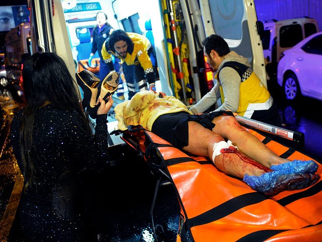 Medics carry a wounded person at the scene after an attack at a popular nightclub in Istan