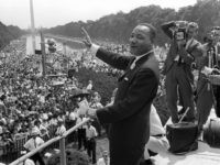 US civil rights leader Martin Luther King, Jr., waves to supporters from the steps of the Lincoln Memorial 28 August, 1963, on The Mall in Washington, DC, during the 'March on Washington' where King delivered his famous 'I Have a Dream' speech, which is credited with mobilizing supporters of desegregation …