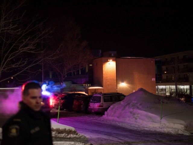 Canadian police officers respond to a shooting in a mosque at the Québec City Islamic cultural center on Sainte-Foy Street in Quebec city on January 29, 2017. Two arrests have been made after five people were reportedly shot dead in an attack on a mosque in Québec City, Canada. / …