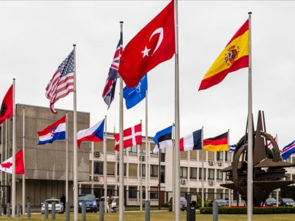 NATO country flags wave outside NATO headquarters in Brussels on Tuesday July 28, 2015. For just the fifth time in its 66-year history, NATO ambassadors met in emergency session Tuesday to gauge the threat the Islamic State extremist group poses to Turkey, and the debated actions Turkish authorities are taking …