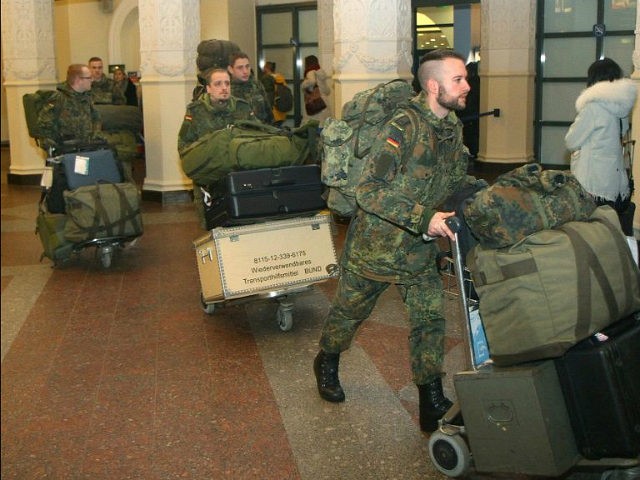 German soldiers walk after arriving at the airport Vilnius, Lithuania, on January 24, 2017