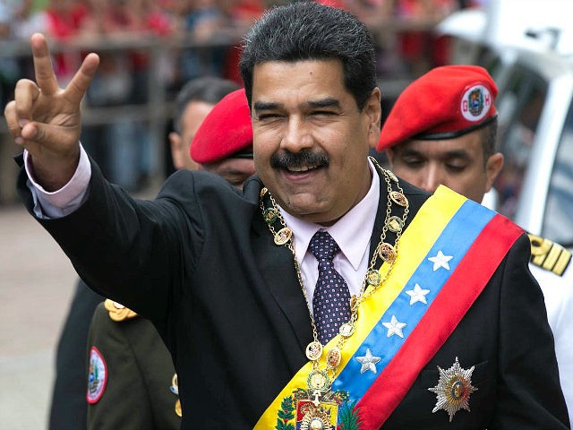 Venezuela's President Nicolas Maduro flashes a victory sign to supporters as he arrives to the Supreme Court to deliver his annual state of the nation report in Caracas, Venezuela, Sunday, Jan. 15, 2017. For more than half a century, Congress had been the body responsible for receiving the president's annual …