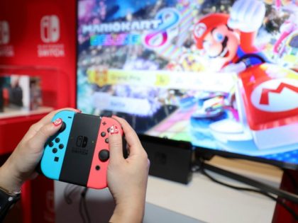 Nintendo of America, A guest enjoys playing Mario Kart 8 Deluxe on the groundbreaking new Nintendo Switch at a special preview event in New York on Jan. 13, 2017. Launching in March 3, 2017, Nintendo Switch combines the power of a home console with the mobility of a handheld. It's …