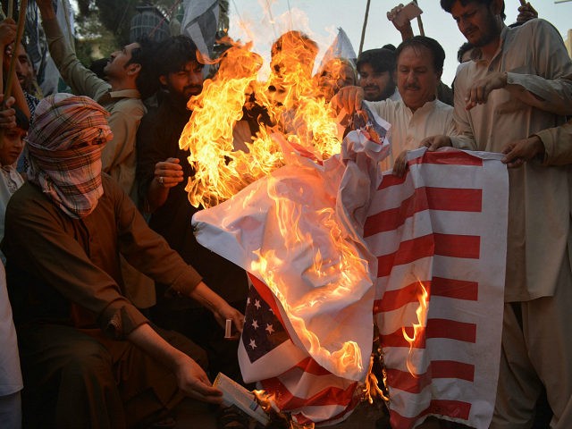 Pakistani demonstrators torch a US flag during a protest against a US drone strike in Pakistan's southwestern province Balochistan, in Quetta on June 10, 2016. Afghan Taliban leader Mullah Akhtar Mansour was killed in a US drone strike deep inside Pakistani territory on May 21 along with a driver. / …