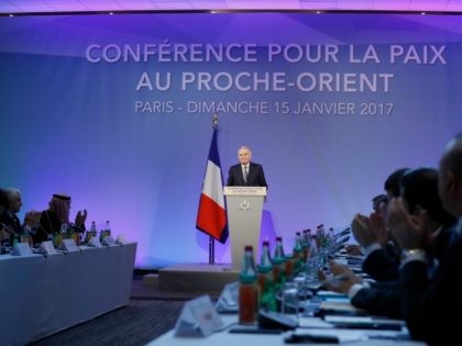 French Minister of Foreign Affairs Jean-Marc Ayrault is applauded as he addresses delegates at the opening of the Mideast peace conference in Paris on January 15, 2017. Around 70 countries and international organisations are making a new push for a two-state solution in the Middle East at the conference in …