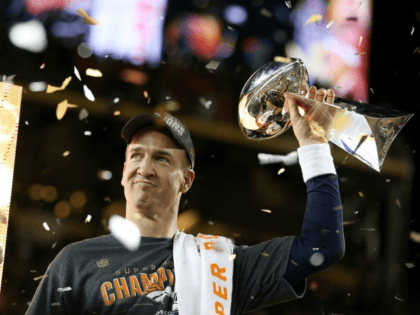 Peyton Manning of the Denver Broncos celebrates with the Vince Lombardi Trophy after Super