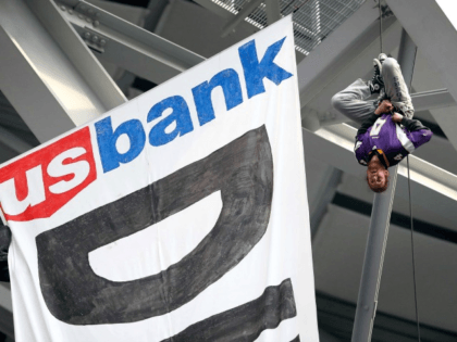 Pipeline protestors hang banner from U.S. Bank Stadium to promote cause