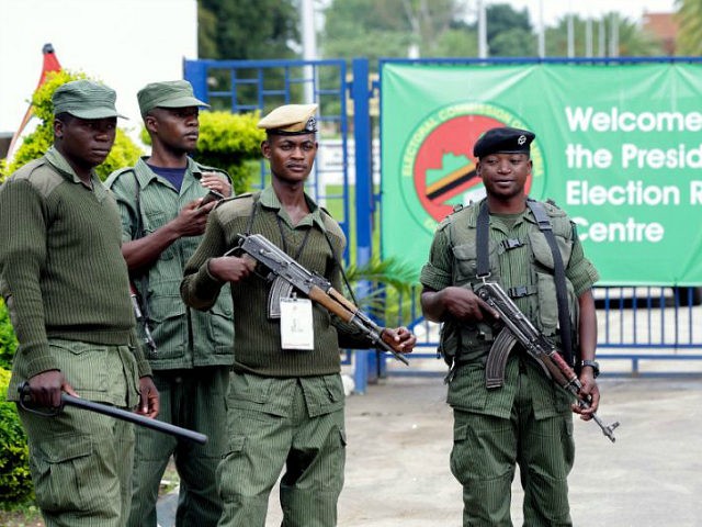 Zambian police officers stand guard outside the Presidential Election results centre, Mulu