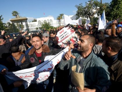 Tunisian unemployed people shout slogans during a demonstration against the government&#03