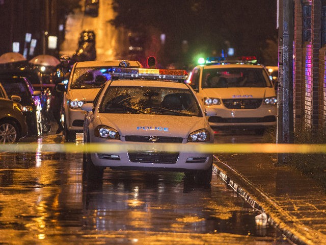 Police secure the theatre after a gunman opened fire during the victory speech of Quebec&