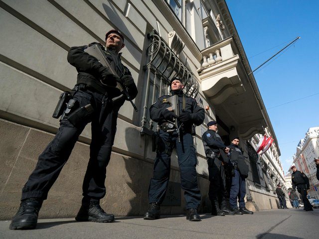 Austrian police officers guard the entrance to the West-Balkan conference "Managing Migration together" at the Austrian interior ministry in Vienna, Austria on February 24, 2016. Austria hosts talks with countries along the well-trodden migrant path through the western Balkans to northern Europe, as tighter border controls raise fears of a …
