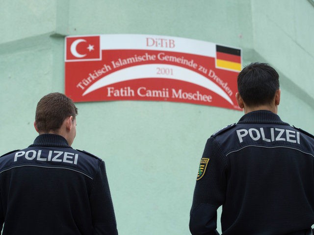 Two policemen stand in front of the Fatih Camii Mosque in Dresden, eastern Germany, on Sep