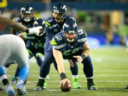 Quarterback Russell Wilson of the Seattle Seahawks gets ready to run a play against the De