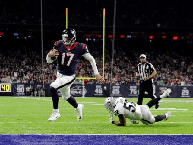 Brock Osweiler #17 of the Houston Texans rushes for a touchdown during the fourth quarter