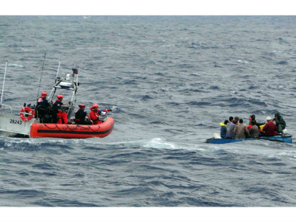 FILE - In this Jan. 4, 2016 file photo released by the U.S. Coast Guard, Coast Guard personnel arrive to assist Cuban migrants on a makeshift vessel in the Florida Straits. President Barack Obama announced Thursday, Jan. 12, 2017 he is ending a longstanding immigration policy that allows any Cuban …