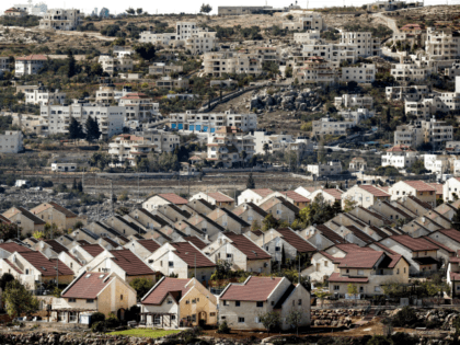 A picture taken on November 17, 2016 shows a general view of houses in the settlement of Ofra in the Israeli-occupied West Bank, established in the vicinity of the Palestinian village of Baytin (background). / AFP / THOMAS COEX (Photo credit should read THOMAS COEX/AFP/Getty Images)