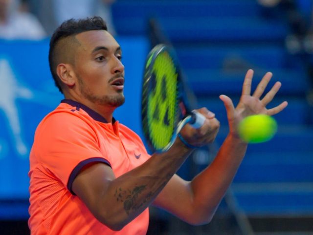 Nick Kyrgios of Australia hits a return to Feliciano Lopez of Spain during their men's sin