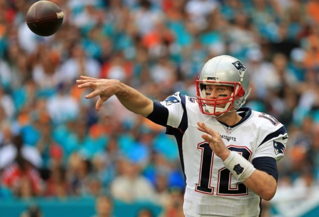 Tom Brady of the New England Patriots passes during a game against the Miami Dolphins at H