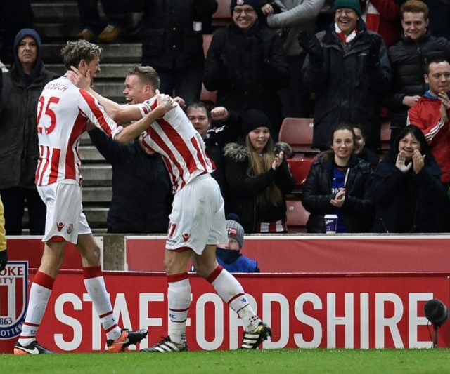 Stoke City's Peter Crouch (L) celebrates with teammate Ryan Shawcross after scoring their