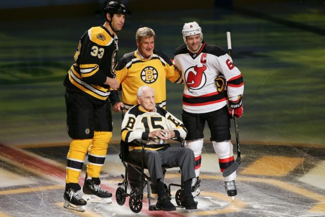 Zdeno Chara (L) of the Boston Bruins and Andy Greene (R) of the New Jersey Devils stand wi