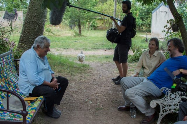 Former Uruguayan President and guerrilla Jose Mujica (L) is being interviewed by Serbian f
