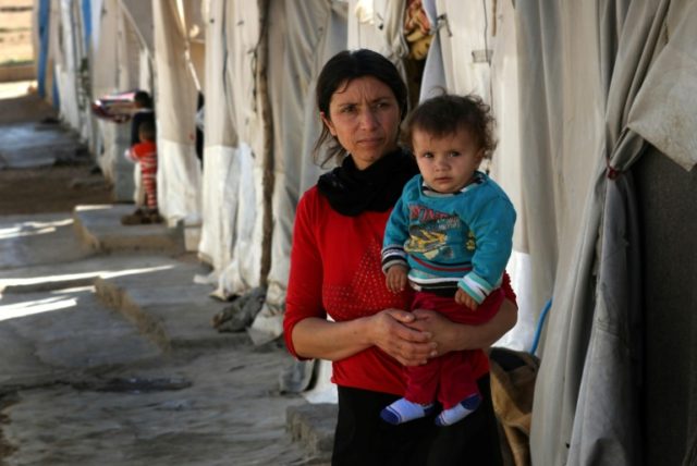 A displaced Iraqi woman from the Yazidi community, who fled violence between Islamic State